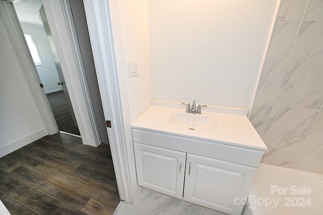 bathroom featuring vanity and hardwood / wood-style flooring