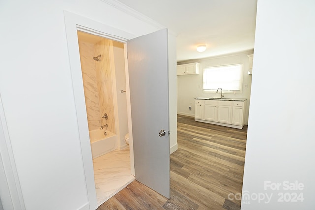 hall with sink and hardwood / wood-style floors