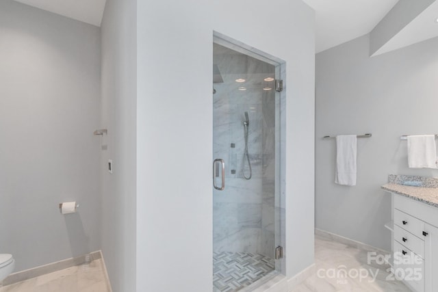 18212 Pompano Pl, Cornelius, NC 28031 - bathroom featuring baseboards, vanity, toilet, and a stall shower