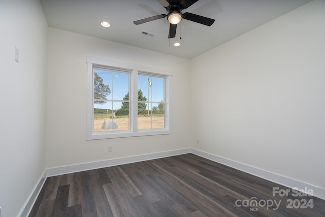 unfurnished room with ceiling fan and dark hardwood / wood-style floors