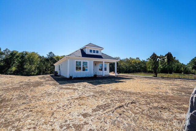 view of front of home featuring cooling unit