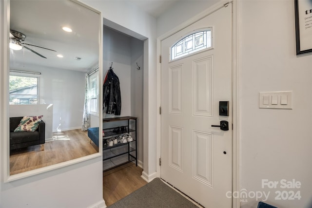 entrance foyer with ceiling fan and hardwood / wood-style floors