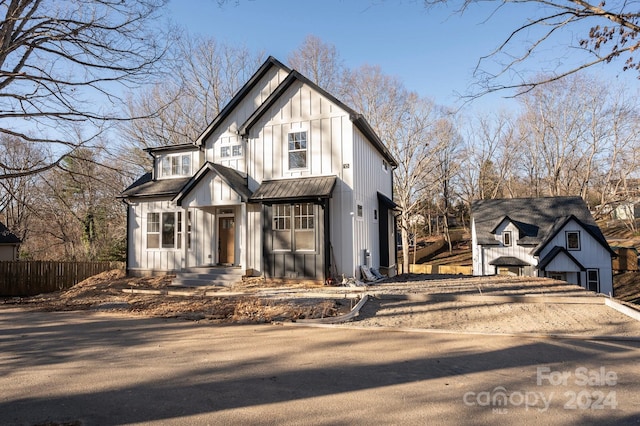 modern inspired farmhouse featuring a garage