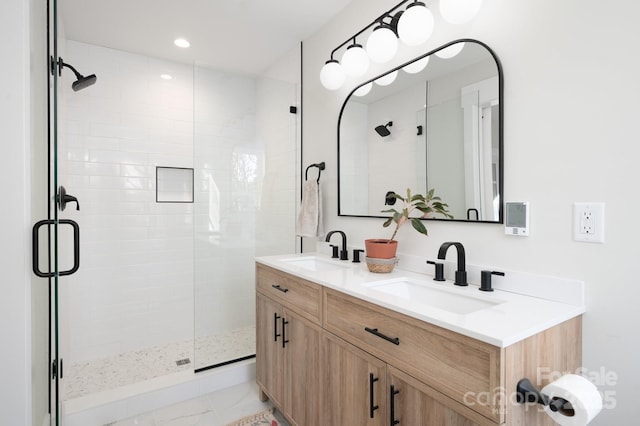 bathroom with vanity and an enclosed shower