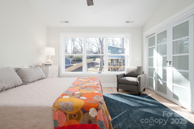 bedroom with ceiling fan and hardwood / wood-style floors