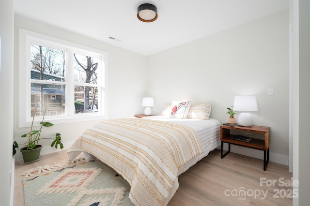 bedroom featuring light wood-type flooring