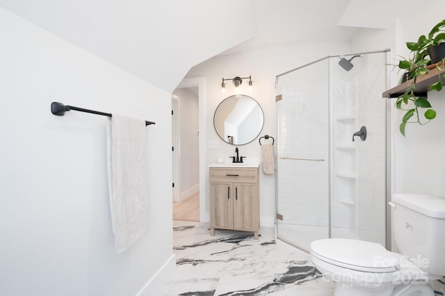 bathroom with a shower with door, vanity, and toilet