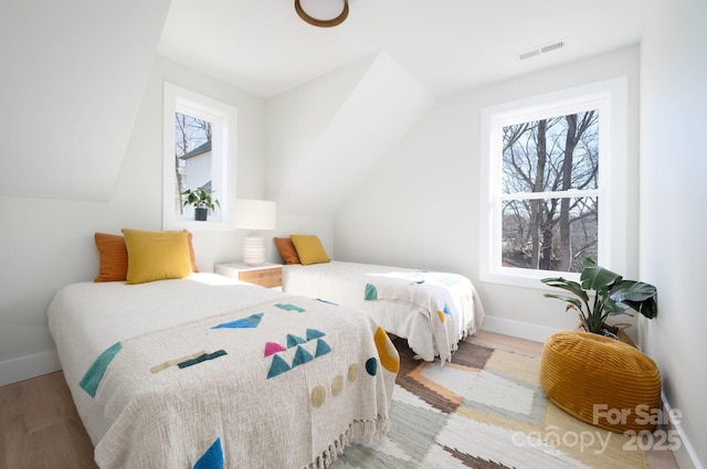 bedroom with light hardwood / wood-style floors