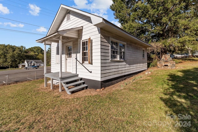 view of home's exterior with a yard