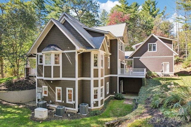 rear view of house with central air condition unit