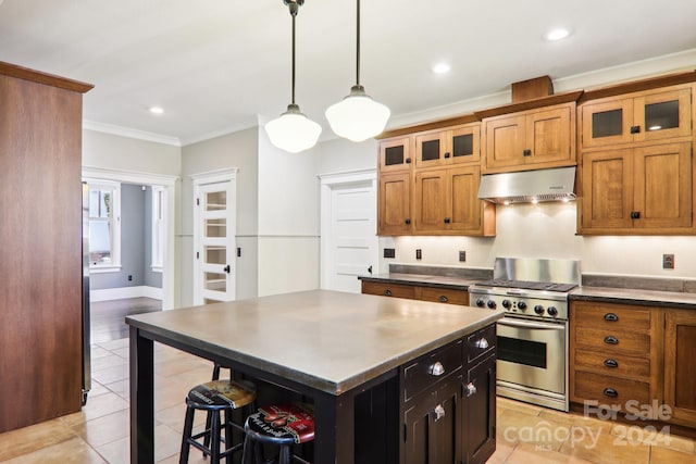 kitchen with a center island, ornamental molding, hanging light fixtures, stainless steel stove, and extractor fan