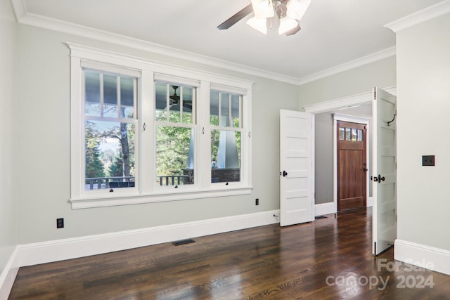 unfurnished room with crown molding, ceiling fan, and dark hardwood / wood-style flooring