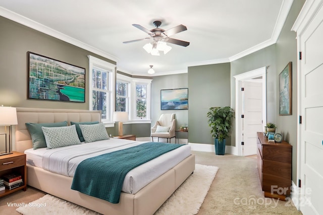 carpeted bedroom featuring ornamental molding and ceiling fan