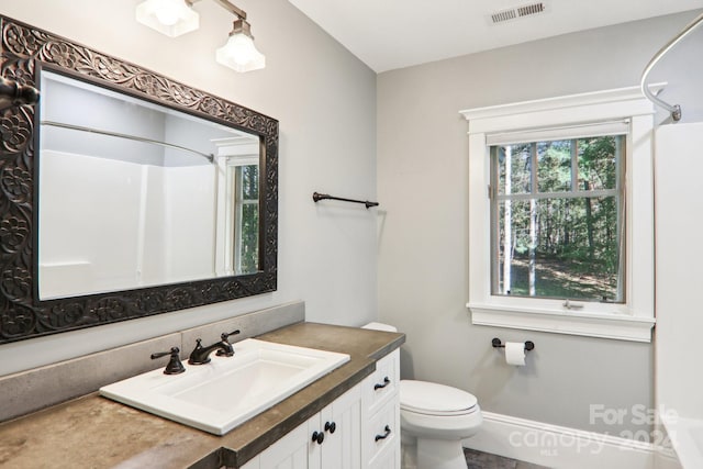 full bathroom with vanity, toilet, and shower / bathtub combination