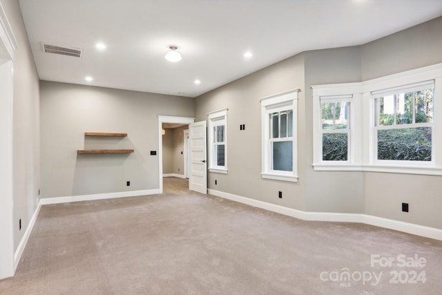 spare room with light colored carpet