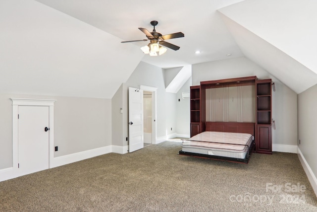 unfurnished bedroom with carpet floors, ceiling fan, and vaulted ceiling