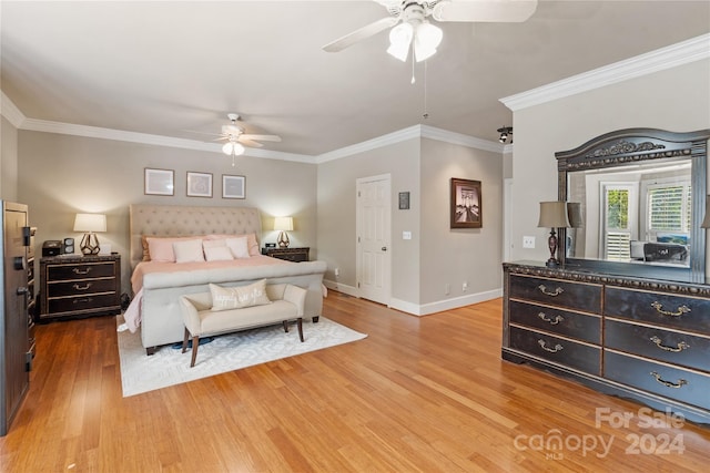 bedroom with crown molding, hardwood / wood-style floors, and ceiling fan