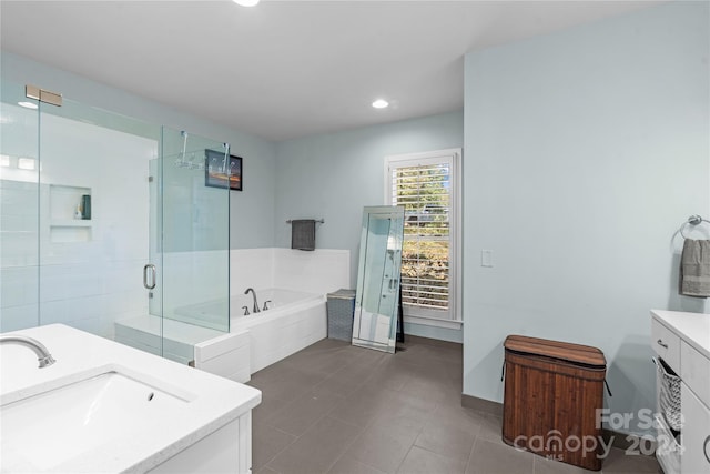 bathroom featuring vanity, separate shower and tub, and tile patterned flooring