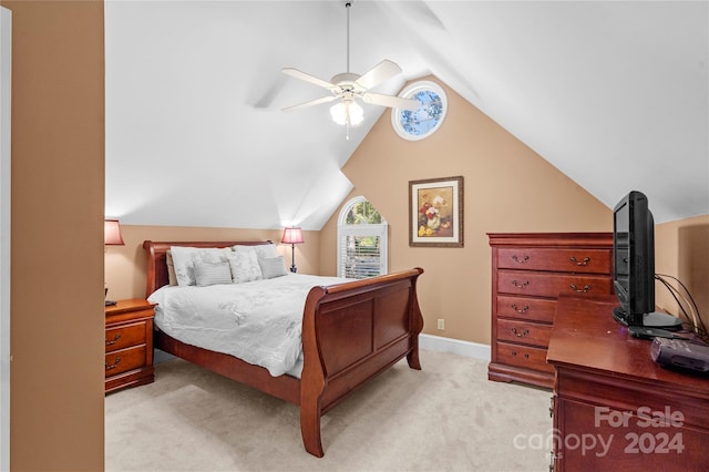 bedroom featuring light carpet, lofted ceiling, and ceiling fan