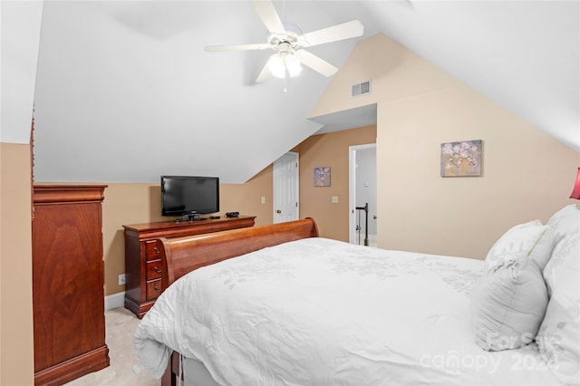 bedroom with lofted ceiling, light colored carpet, and ceiling fan