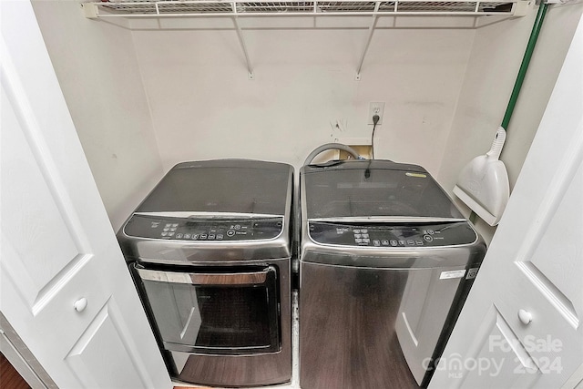 washroom featuring separate washer and dryer and hardwood / wood-style floors