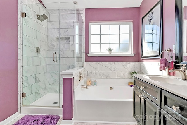 bathroom featuring vanity and separate shower and tub