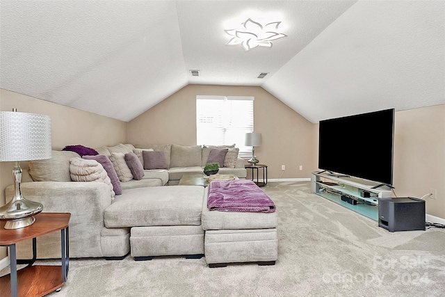 living room with vaulted ceiling, a textured ceiling, and carpet floors