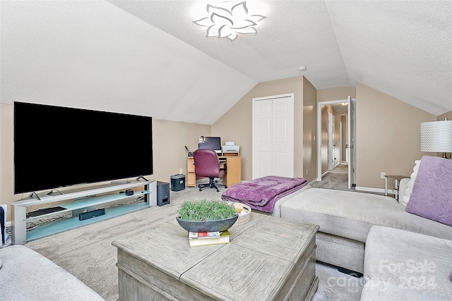 living room with light carpet, a textured ceiling, and vaulted ceiling