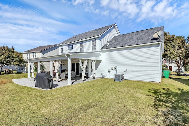 rear view of house featuring a patio, a yard, and central air condition unit