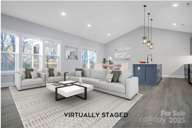 living room with recessed lighting, wood finished floors, visible vents, baseboards, and vaulted ceiling