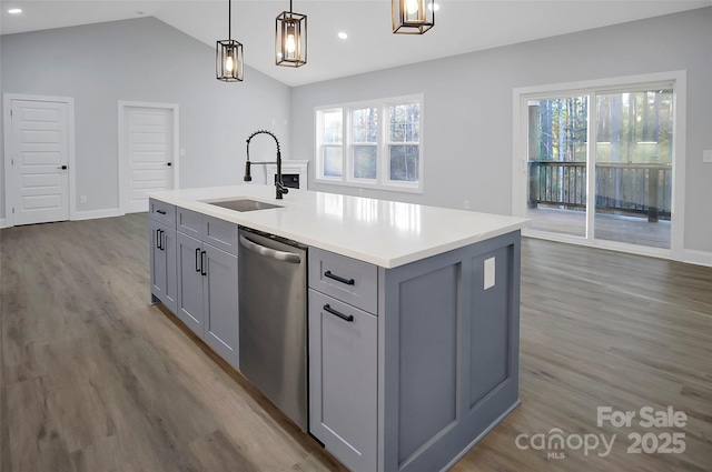 kitchen with a sink, a wealth of natural light, gray cabinets, and dishwasher