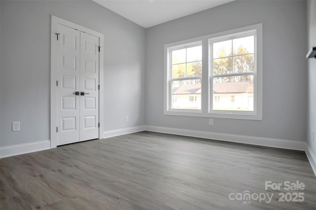 spare room featuring light hardwood / wood-style floors