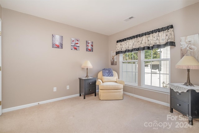 sitting room featuring baseboards, carpet flooring, and visible vents