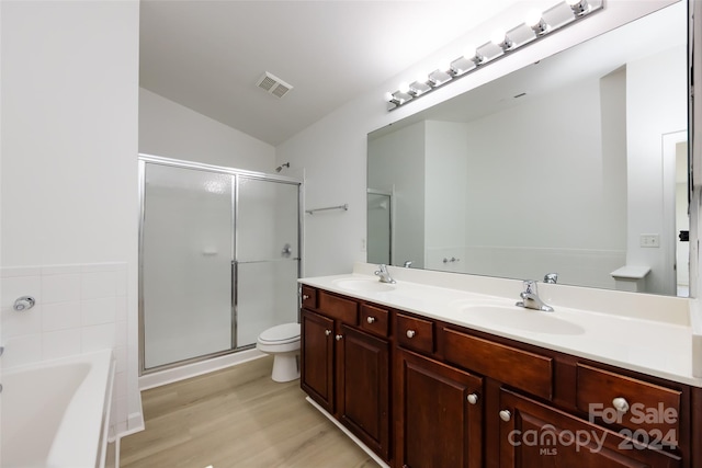 full bathroom with vanity, toilet, lofted ceiling, and plus walk in shower