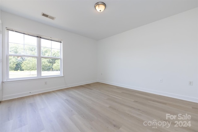 unfurnished room featuring light hardwood / wood-style floors