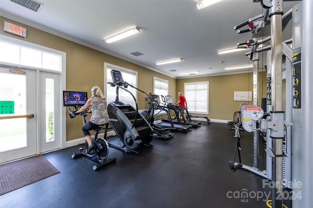 gym featuring crown molding