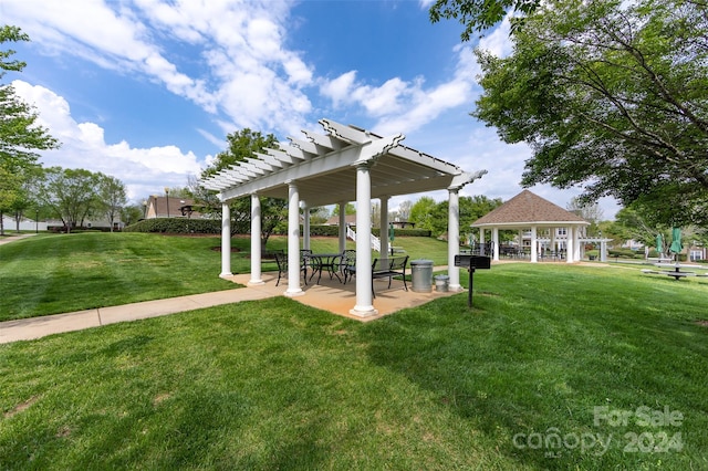 view of property's community featuring a gazebo and a lawn