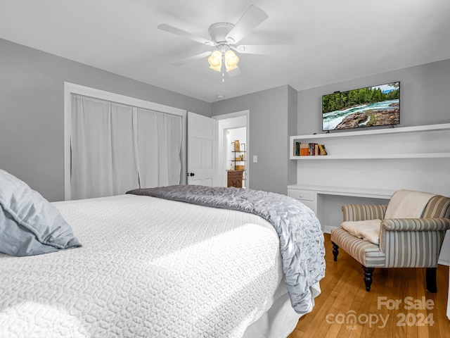 bedroom with wood-type flooring and ceiling fan