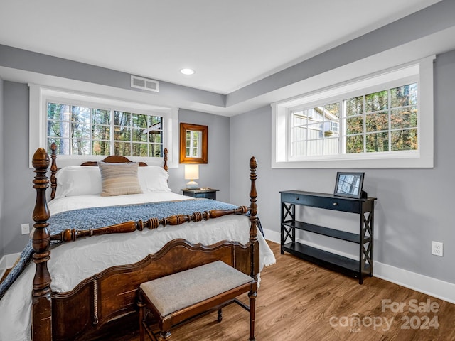 bedroom with hardwood / wood-style floors