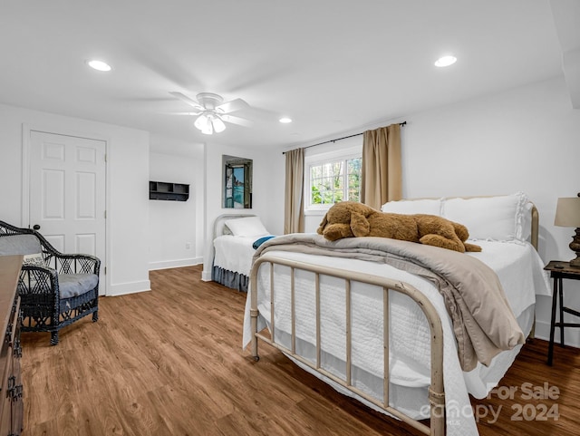 bedroom featuring ceiling fan and wood-type flooring