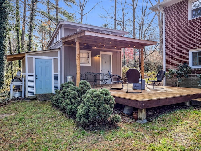 wooden deck with a lawn