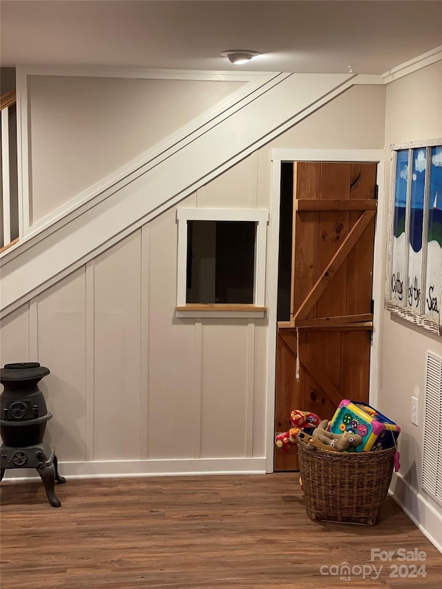 additional living space featuring dark wood-type flooring