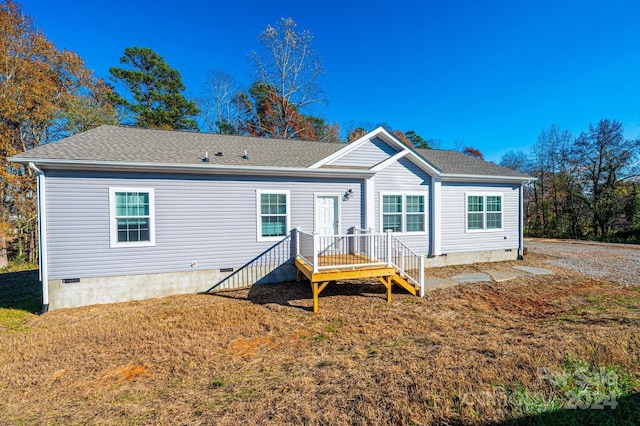 rear view of house with a yard