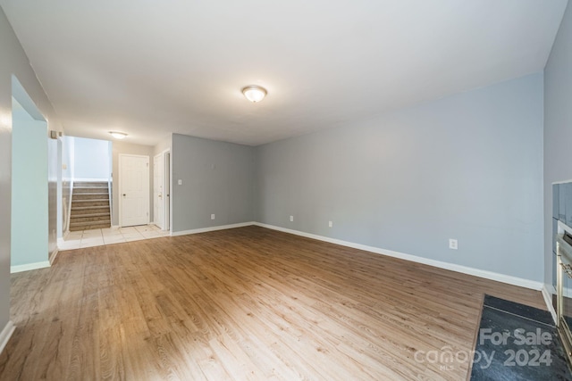 unfurnished living room featuring light hardwood / wood-style flooring