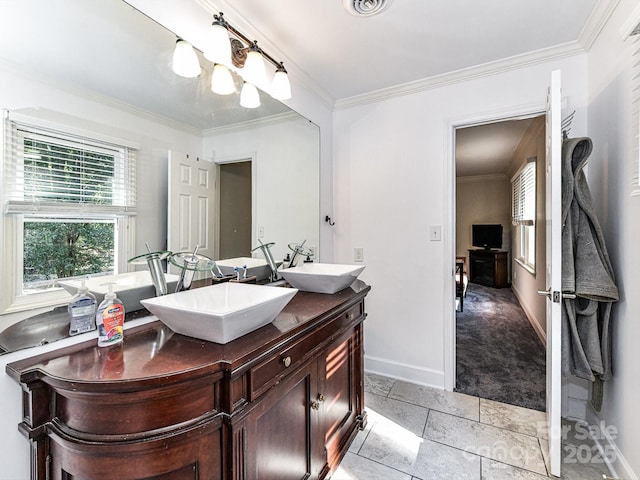 bathroom featuring vanity, ornamental molding, and tile patterned flooring