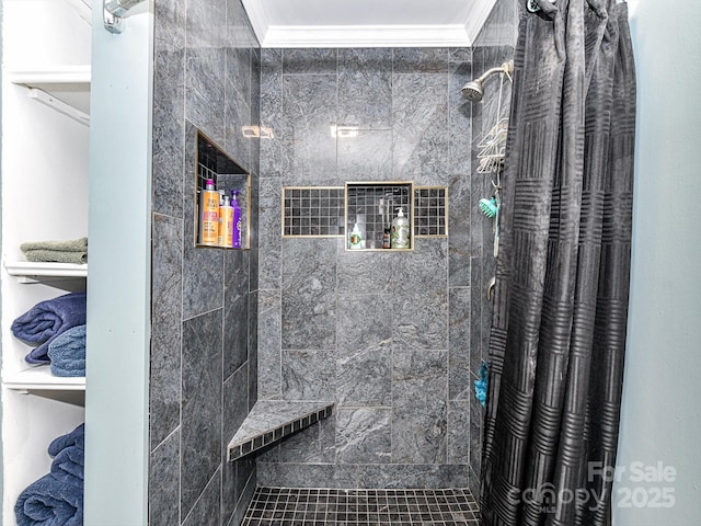 bathroom featuring crown molding and a shower with shower curtain