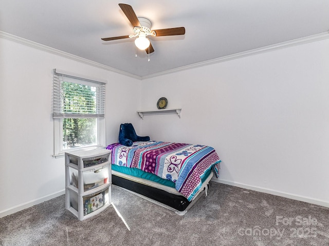 bedroom with ceiling fan, crown molding, and carpet floors