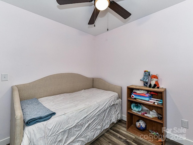 bedroom featuring ceiling fan and dark hardwood / wood-style flooring