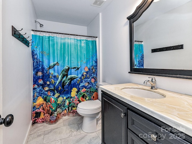 bathroom with toilet, vanity, and a shower with curtain