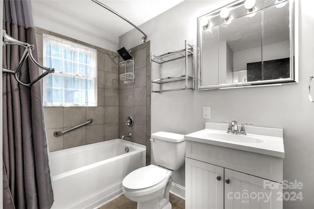 full bathroom featuring vanity, shower / bath combo with shower curtain, and toilet